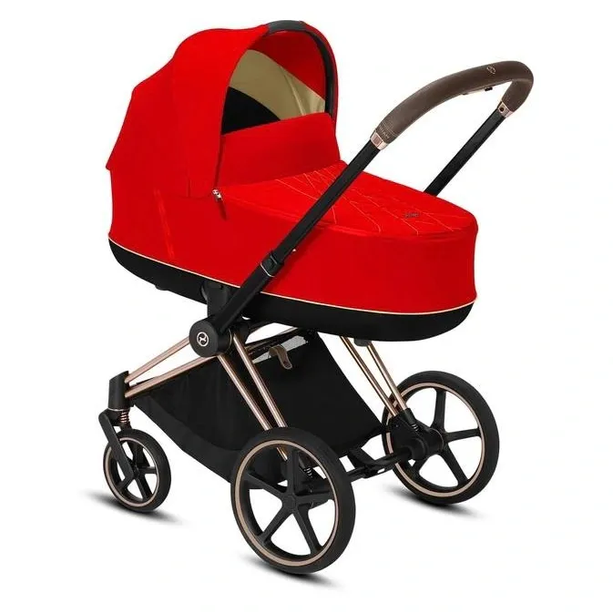 Люлька Cybex Priam Lux глубокого красного цвета на шасси цвета розового золота